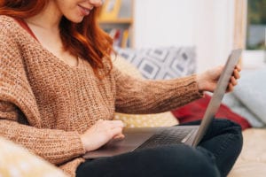 Red haired woman on laptop